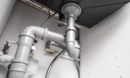 "On The Way Plumbing offers thorough plumbing inspections, checking pipes under sinks for leaks and system maintenance.