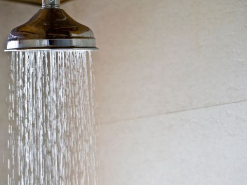 "On The Way Plumbing installs PRV (Pressure Reducing Valve) devices to regulate water pressure and protect plumbing systems—pictured, a controlled flow from a showerhead