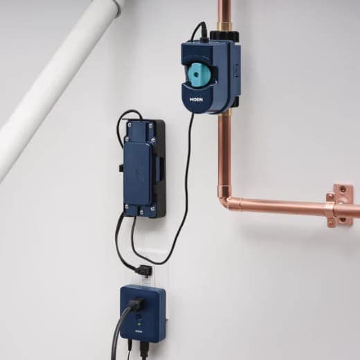Moen Flo Smart Water Shutoff device installed on a residential main water line